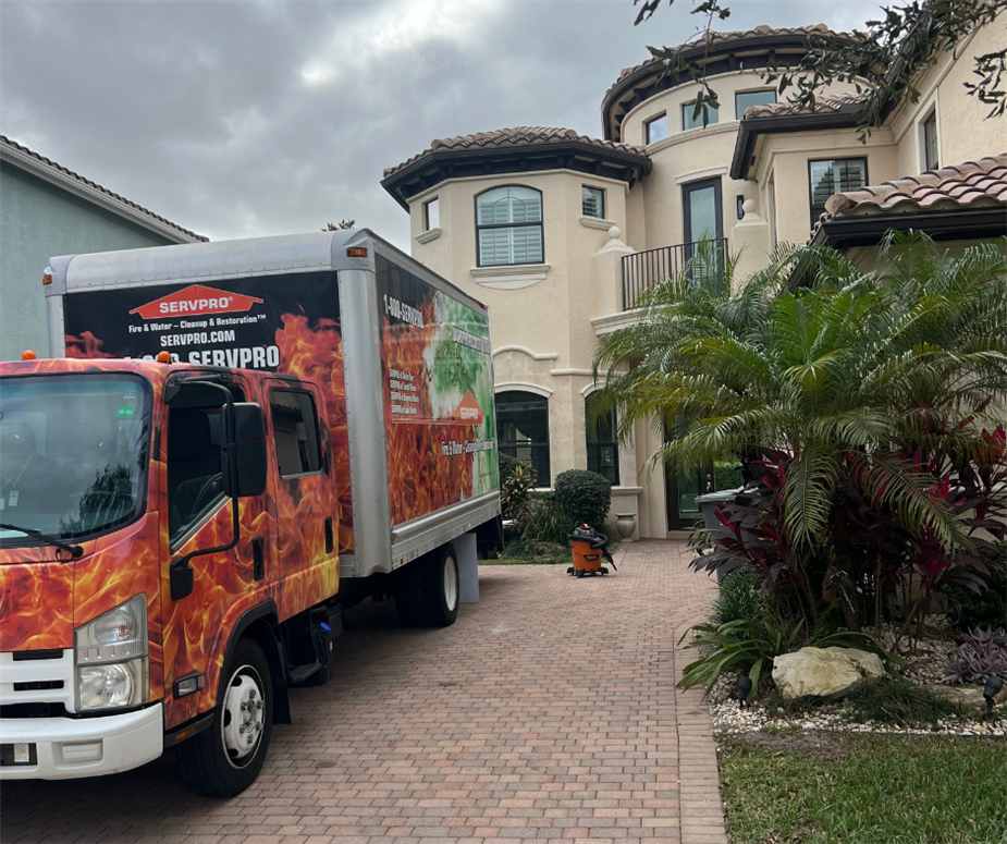 Boynton Beach mold-infected home with a SERVPRO team on site.